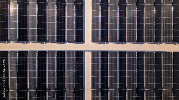 Obraz Solar panels creating geometric pattern producing clean energy