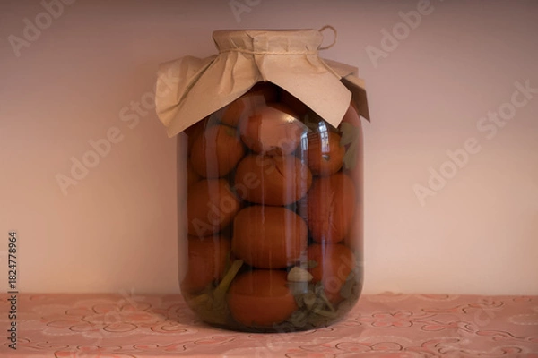 Obraz Glass jar with pickled tomatoes sealed with paper cover