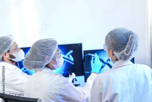 Fototapeta Biotech experts utilizing AI-driven genomic sequencing for molecular analysis in smart lab, optimizing high-throughput drug discovery and precision medicine workflow.