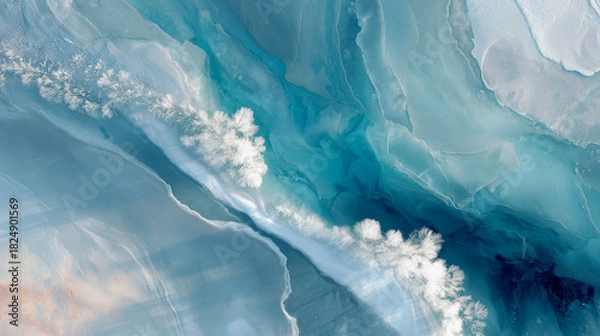 Obraz Frozen lake with swirling blue, teal and white pattern. Frost  and snow covered trees. Abstract winter background