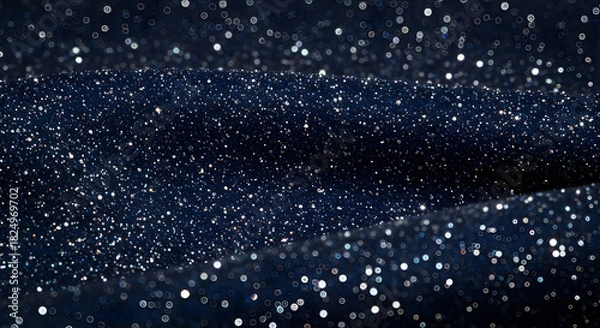 Fototapeta A captivating closeup of a dark blue glitter fabric, shimmering with countless tiny white particles, creating a luxurious and festive abstract background texture