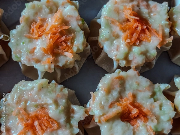 Obraz Fresh Dim Sum Filling with Wonton Wrappers and Carrot Topping