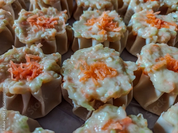Obraz Fresh Dim Sum Filling with Wonton Wrappers and Carrot Topping