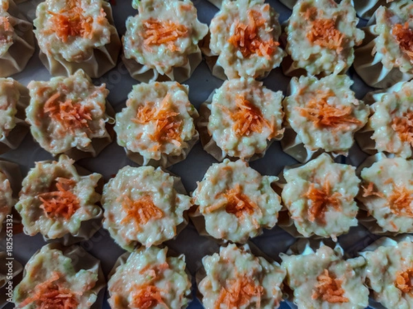 Obraz Fresh Dim Sum Filling with Wonton Wrappers and Carrot Topping