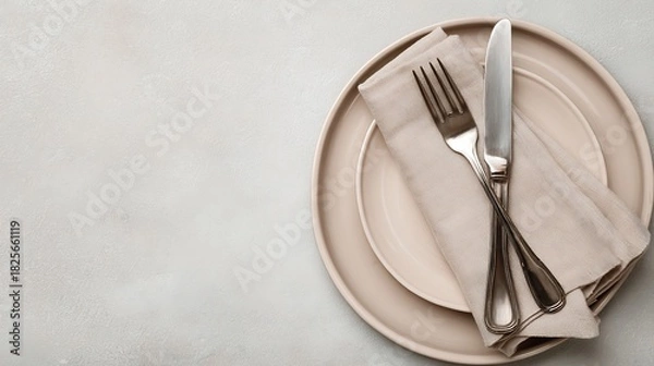 Obraz Elegant Table Setting with Beige Plates Silver Cutlery and Linen Napkin on Textured Gray Background Neutral Tones Top View