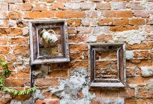 Fototapeta Frames on old brick wall