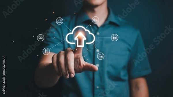 Fototapeta Businessman interacts with a glowing digital interface representing cloud storage upload functionality