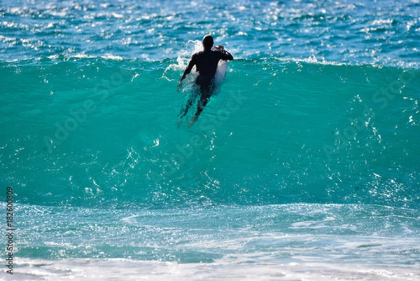 Fototapeta serfist on a wave