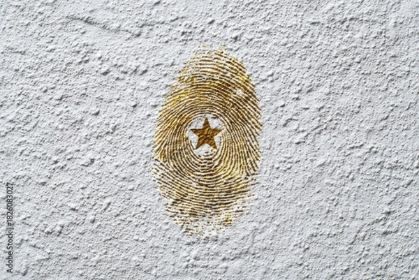 Fototapeta Gold Fingerprint with Star Symbol on Textured Wall