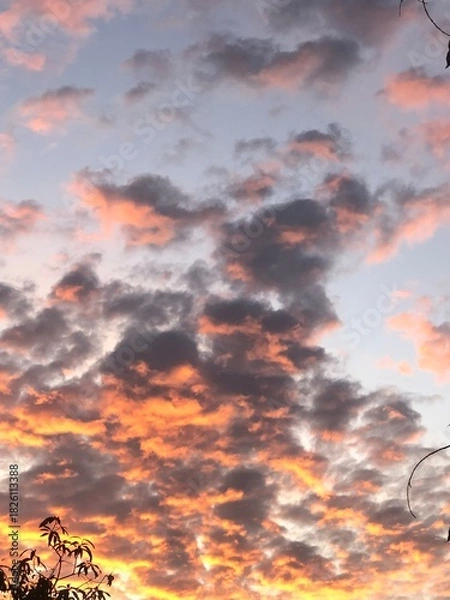 Fototapeta sunset in the clouds, gllomy sky with dark gray clouds	