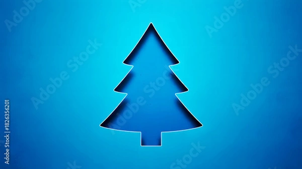 Obraz A christmas tree cutout in a blue paper with a slightly darker shade inside the tree shape design