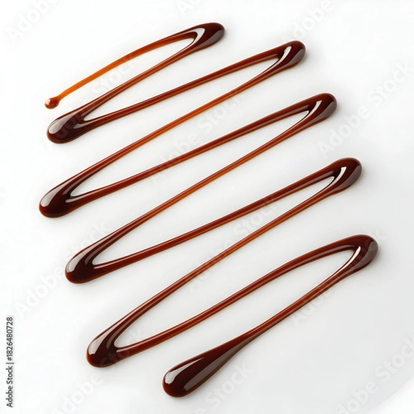 Fototapeta Chocolate syrup swirl drizzle isolated on white