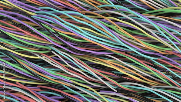 Fototapeta Twisted multicolored cables and wires on black surface