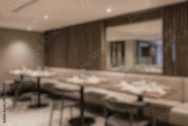 Fototapeta Blurred image of restaurant with light and bokeh for background usage. Blur interior background concept.