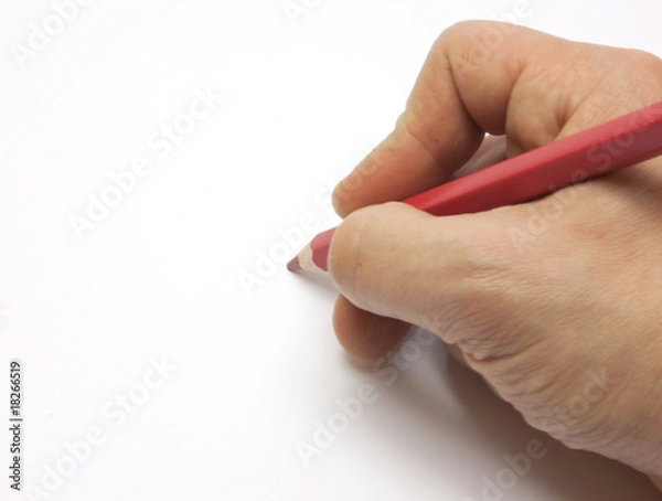 Fototapeta Pencil in man hand isolated on white background.