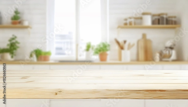 Fototapeta Light Wood Kitchen Countertop Foreground with Green Plants and White Kettle Blurred Background Mockup
