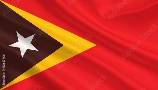 Fototapeta Timor-Leste flag with red field, black and yellow triangles, and white star.