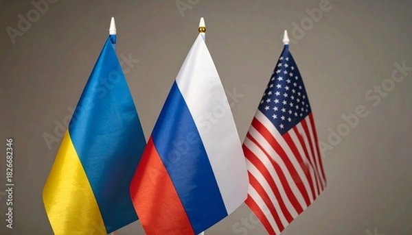 Fototapeta Flags of Ukraine, Russia, and the United States side by side, symbolizing global presence and identity.