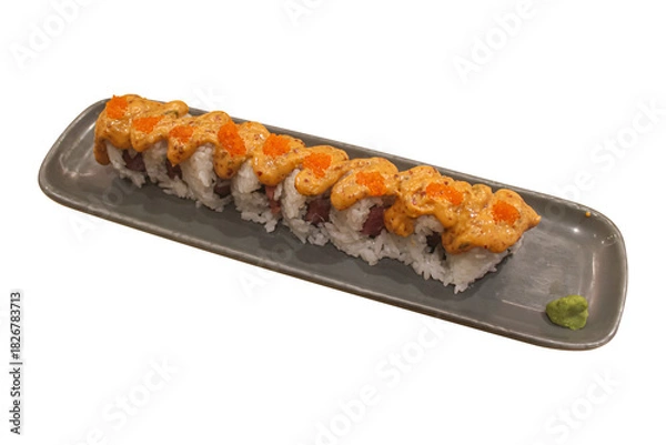 Fototapeta Spicy Tuna Sushi Roll Topped with Masago and Creamy Sauce