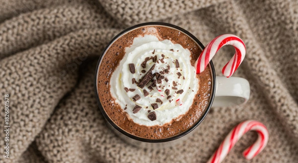 Obraz Traditional Christmas Drink with Candy Cane and Chocolate Chips on Wood