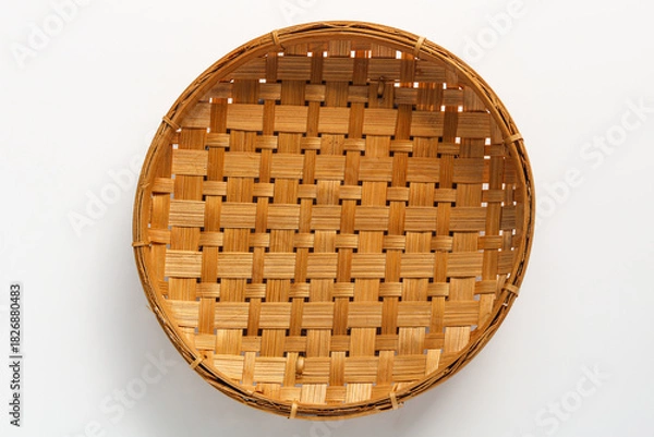 Fototapeta Top view of a Winnowing Basket (Tampah), isolated on a white background.
