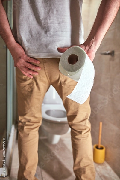 Obraz Man with urge to go to the toilet at home.