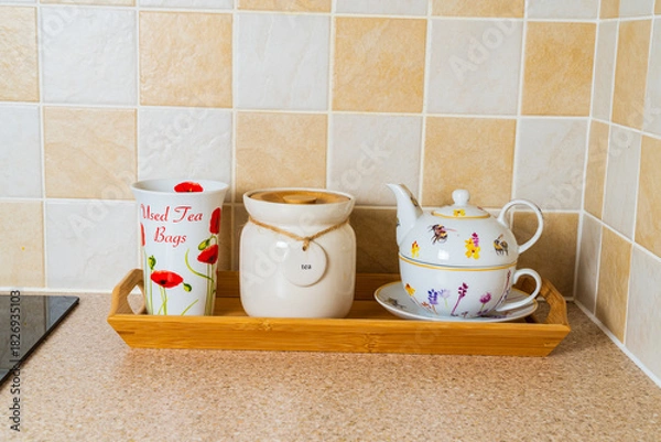 Fototapeta Teapot, tea caddy and container for used tea bags for preparing a cup of tea