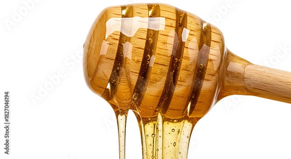 Obraz Honey dripping from a wooden dipper, showcasing natural sweetness and golden texture