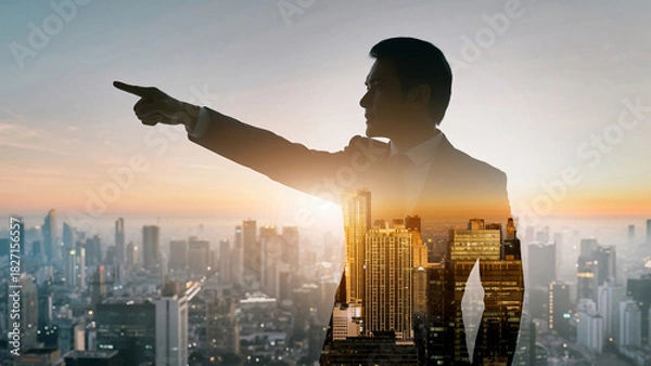 Fototapeta 朝日夕日の中の都市オフィスで進路を指し示すビジネスパートナーリーダーと従う従業員の選択した進む未来