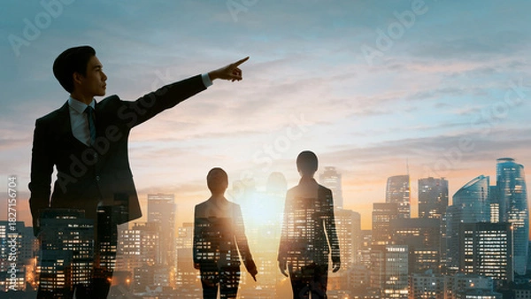 Fototapeta 朝日夕日の中の都市オフィスで進路を指し示すビジネスパートナーリーダーと従う従業員の選択した進む未来
