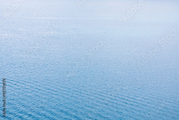 Obraz Blue sea water surface texture with ripples, splashes