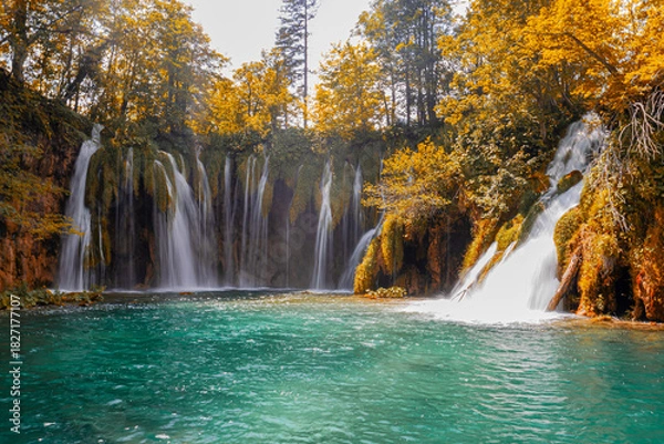 Obraz Autumn view of cascading waterfalls surrounded by vegetation, Plitvice Lakes, Croatia.