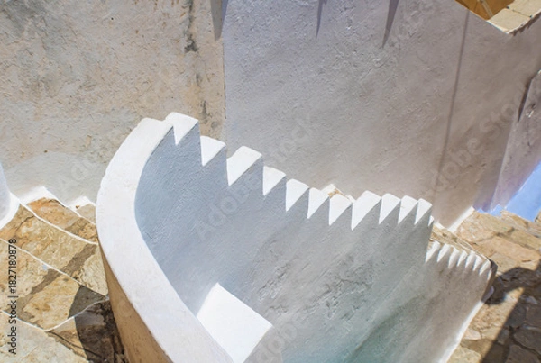 Fototapeta Top view of old  stone staircase the white railing, Symi island, Greece