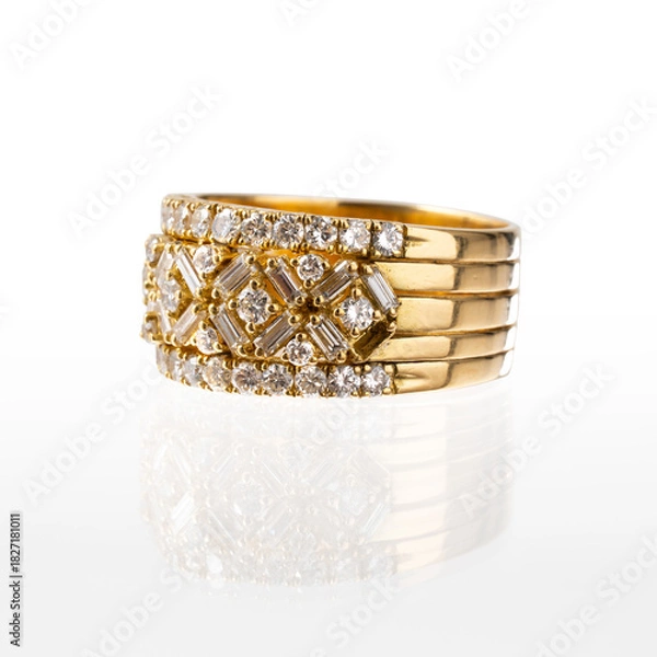 Fototapeta 18kt yellow gold ring with brilliant and baguette cut diamonds, photographed on a white background with reflection