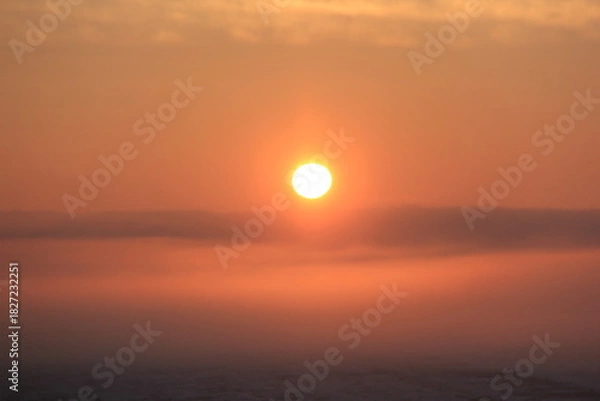 Fototapeta Crisp and Cold Sunrise in the Fog Covered Valley.