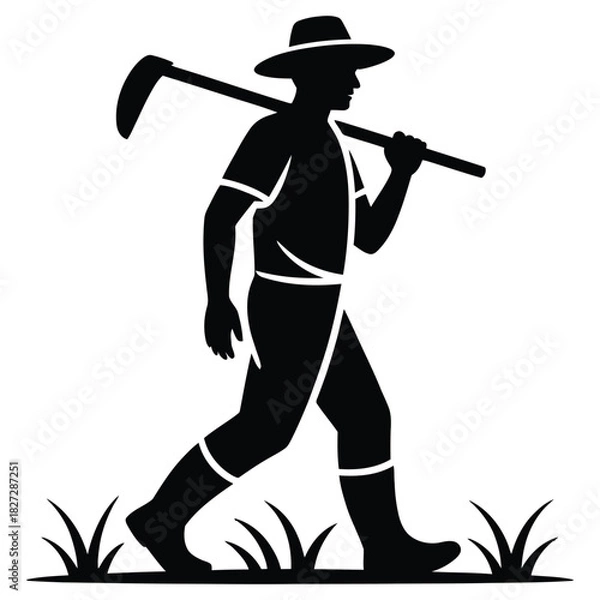 Fototapeta Silhouette of a farmer walking with a hoe isolated on