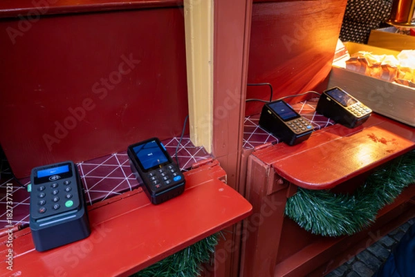 Obraz Stockholm, Sweden A  row of four credit card terminals at an outdoor stall.