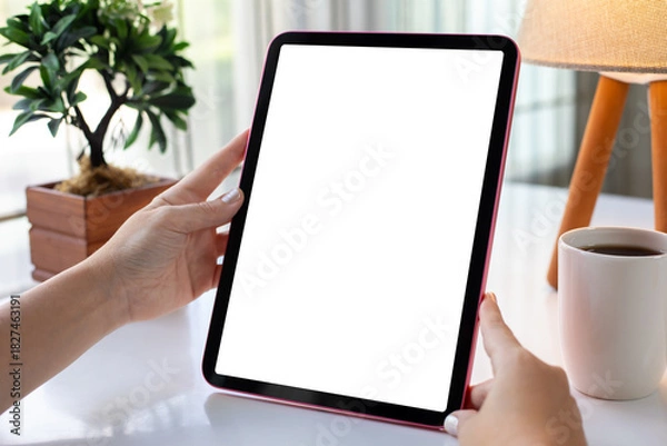 Obraz Female hands holding computer tablet with isolated screen background cafe