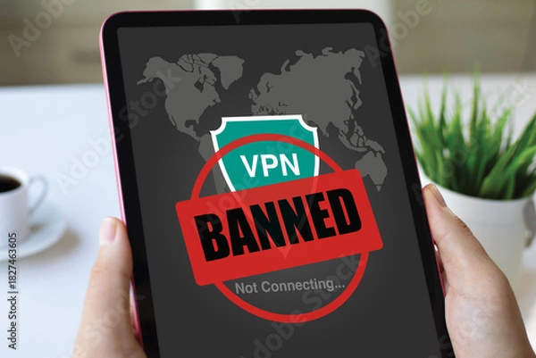 Obraz male hands holding computer tablet with VPN banned of screen