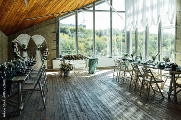 Fototapeta Elegant festive table setting with green decor and glassware