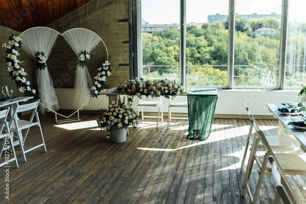 Fototapeta Elegant festive table setting with green decor and glassware