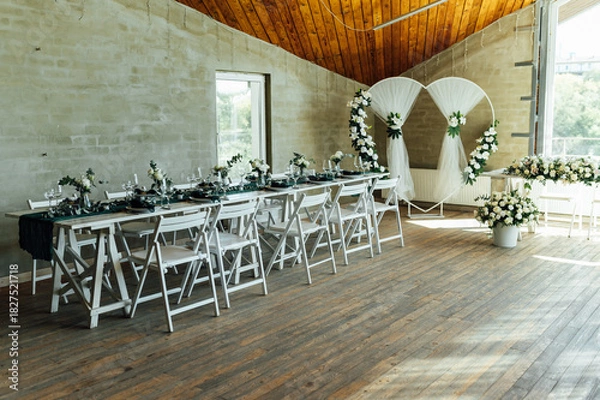Fototapeta Elegant festive table setting with green decor and glassware