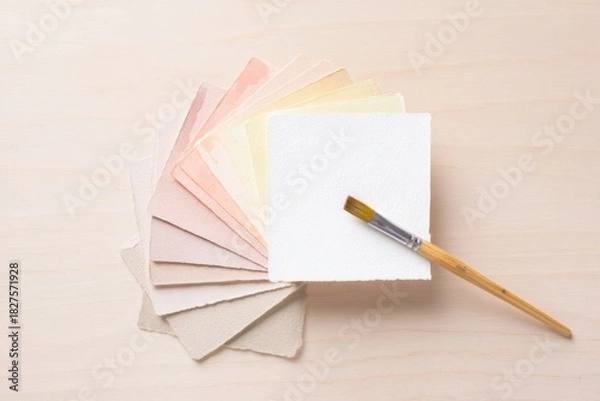 Obraz Selection of pastel colored paper sheets with a paintbrush