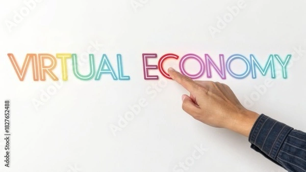 Fototapeta Hand pointing to the word virtual economy isolated on white background