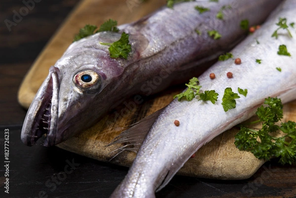 Obraz Woman in brown bathrobe touching cream with finger and holding a cosmetic jar closeup