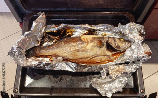 Obraz Freshly baked lavraky fish in a foil