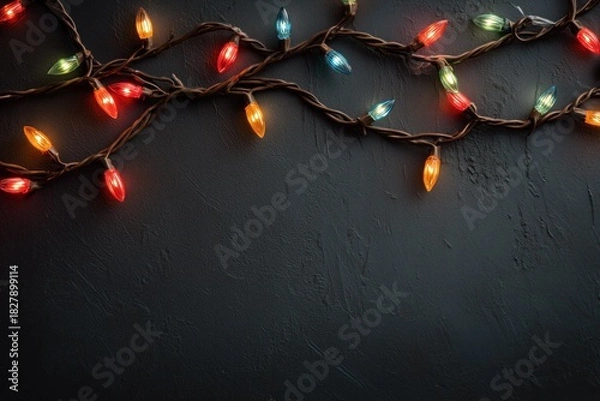Fototapeta Colorful String Lights on Dark Wall Background for Holiday Decor