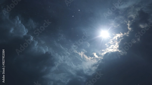 Fototapeta Night Sky with Moonlight Shining Through Dramatic Cloud Cover