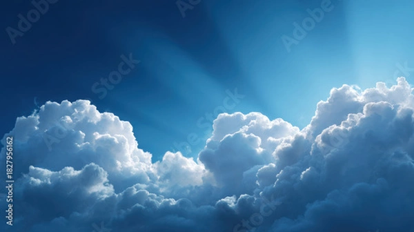 Fototapeta Fluffy White Clouds Drifting in a Deep Blue Sky