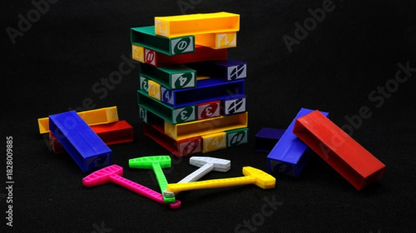Obraz Colorful uno stacko blocks on black background